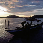 Villagers returning home as the sun sets in the Philippines. Credit: UN Photo