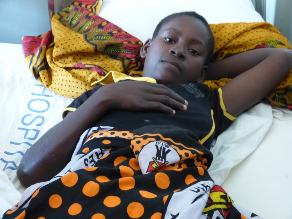 A 15-year-old girl, who was married at age 14, endured two days of obstructed labour, had a stillborn baby, and developed obstetric fistula, recovers from fistula surgery at Nampula Central Hospital, Mozambique. Every year, some 400 women develop obstetric fistula in Mozambique - most are teen mothers and child brides. Credit: Mercedes Sayagues