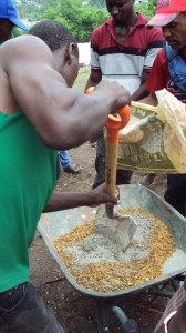 Mixing cement at Petionville Club camp. Photo by Peter Costantini.