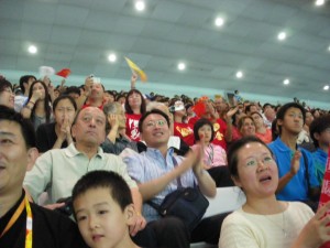 Chinese people cheer their athletes at the Beijing Olympics 